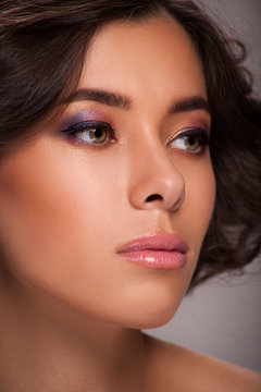 Macro photo of woman face with professional makeup and haircuts. CloseUp