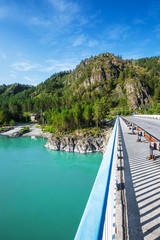 Bridge over the mountain river Katun. The Altai Mountains, Southern Siberia