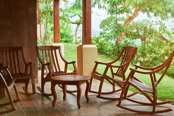Patio with wooden chairs and table