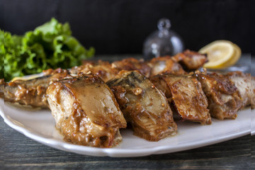 Marinated mackerel slices baked on the grill