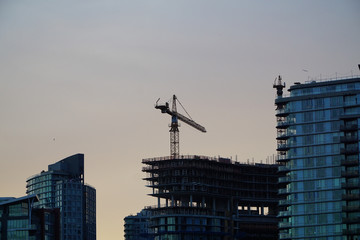 Fototapeta na wymiar Construction cranes in the city