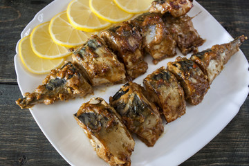 Marinated mackerel slices baked on the grill