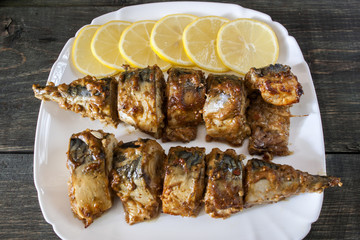 Marinated mackerel slices baked on the grill