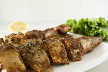 Marinated mackerel slices baked on the grill