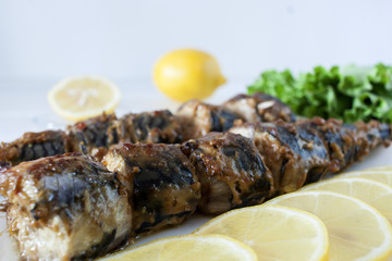 Marinated mackerel slices baked on the grill
