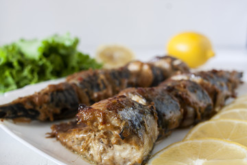 Marinated mackerel slices baked on the grill