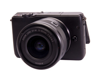 Mirrorless photo camera isolated on white background