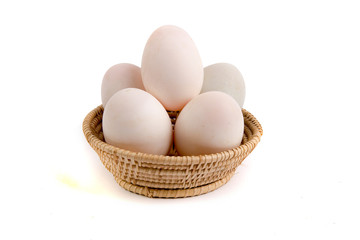 Eggs in the basket Isolated on White Background