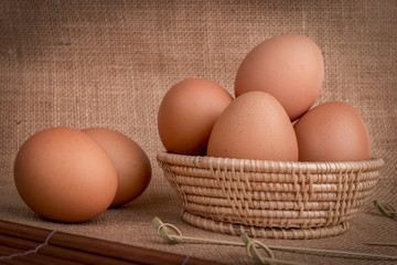 Set Eggs in a basket on  gunny (sackcloth)  background