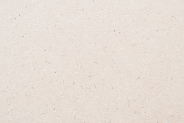 Particleboard, chipboard background with grainy texture of particle presses wooden panel or OSB Oriented strand board in light brown cream sepia color