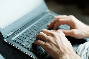 software developer or application designer. internet technology concept. man hands typing on laptop...