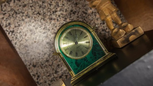 Time lapse clock - camera rotates with big hand of a clock from 01:00-02:00