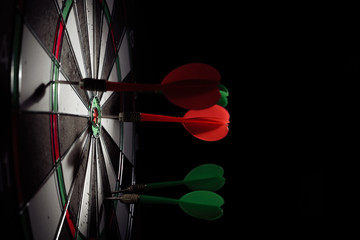 Target with arrow in the center on a black background