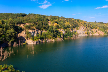 View of the lake at abandoned quarry on summer
