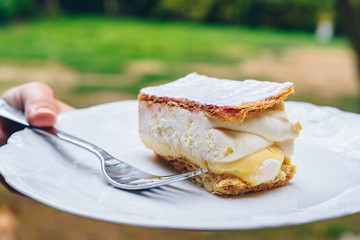 Close up of mille-feuille napoleon pastry on white plate