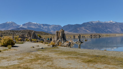 snow covered peaks of Sierra Nevada and tufa towers on the shores of Mono Lake South Tufa Area, Lee Vining, California