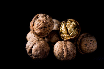 Walnuts on a black background