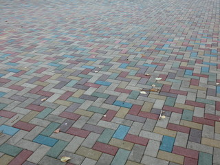 Surface of multi-colored paving slabs