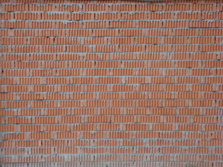 Wall of relief orange bricks