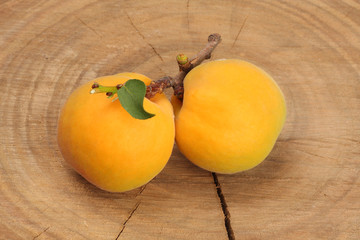 Apricots on wooden background