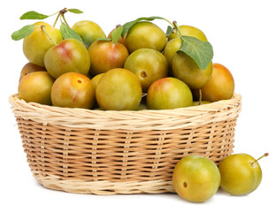 White plums in busket isolated on white background