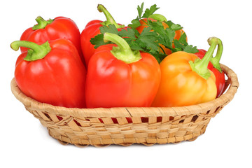 Sweet pepper in a basket isolated on a white background