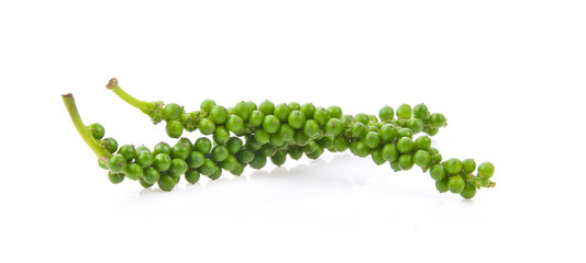 Fresh green peppercorns isolated on a white background.