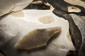  an arrowhead made from flintstone close up - experimental archeology