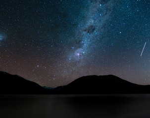 Amazing Starry night at Lake Rotoiti. Reflection of the Milky way and galaxy on the lake. Nelson Lake National Park, New Zealand.