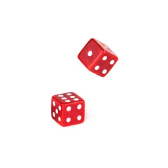 Two red dice isolated on white background. One dice still falls