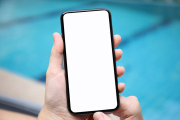 female hands holding phone with isolated screen on background pool