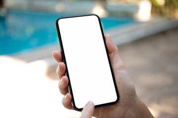female hands holding phone with isolated screen on background pool
