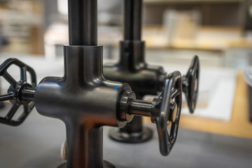Modern stylish retro kitchen sink faucets close-up, focus with shallow depth of field