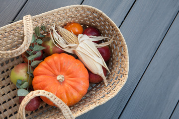 Wicker Basket filled with autumnal Vegetables and Fruits, Thanksgiving