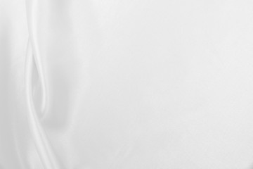 Obraz premium Smooth elegant white silk or satin luxury cloth texture as wedding background. Luxurious background design