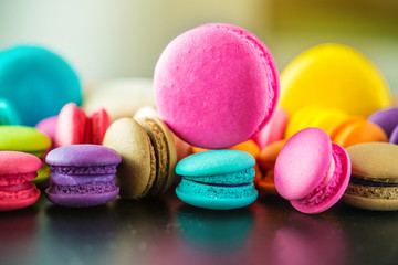 Fototapeta na wymiar colorful macarons dessert with vintage pastel tones. Colorful french macarons background,Different colorful macaroons background.Tasty sweet color macaron,Bakery concept.Selective focus.