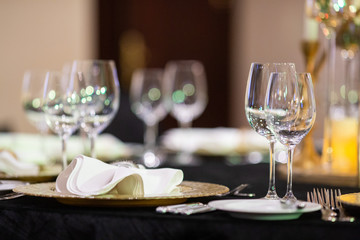 Serving on the table. Crystal glasses