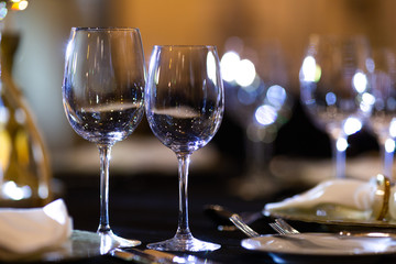 Serving on the table. Crystal glasses