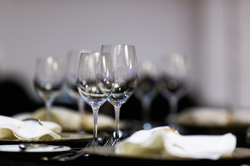 Serving on the table. Crystal glasses