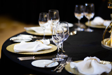 Serving on the table. Crystal glasses