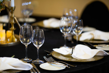 Serving on the table. Crystal glasses