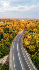 Fototapeta premium aerial view of winding road in romania