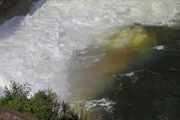 Splashes and spray from waterfall. Big water splash in lake after diving. Splash water on the...