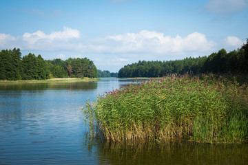 Wydmińskie Lake in Masuria Lakeland region of Poland, Wydminy. - obrazy, fototapety, plakaty