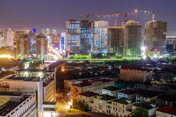 Baku Azerbaijan. Night view of the city. Night lights and bright baku. Homes under construction
