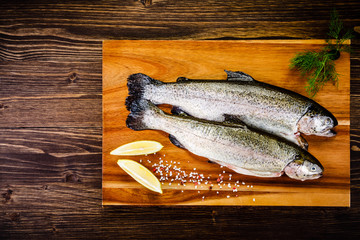 Fresh raw trouts on cutting board