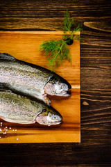 Fresh raw trouts on cutting board