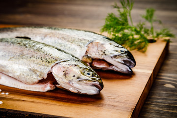 Fresh raw trouts on cutting board