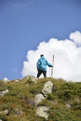 Young happy man on top of a mountain in Italy