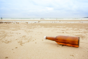 bottle on beach sea and sky.from the sea rinsed bottle on the beach.